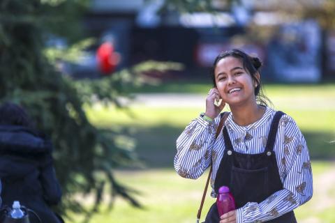 Smiling female student outside on Reading campus